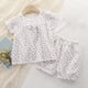 thumbnail image 1 of Conjunto de verano para niñas, cuello redondo, manga corta, estampado floral pequeño con lazo, material de gasa, pijama cómodo y transpirable de dos piezas para niñas pequeñas, conjunto de algodón par, 1 of 5