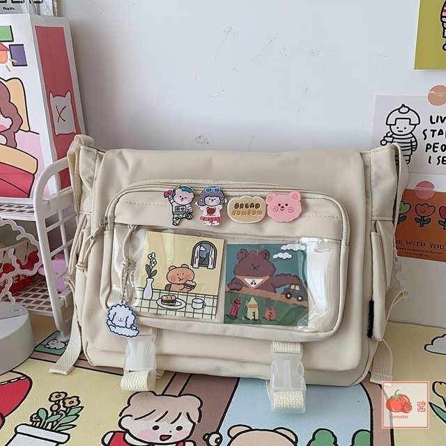 Get Ready for Campus with our Large Capacity Canvas Crossbody Bag - Fashionable and Spacious Shoulder Purse with Bag Charm