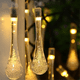thumbnail image 1 of Cadena de luces solares, 8 modos de cadena de luces solares en forma de lágrima - 30 luces LED de cadena solar de 21.3 pies, 1 of 4