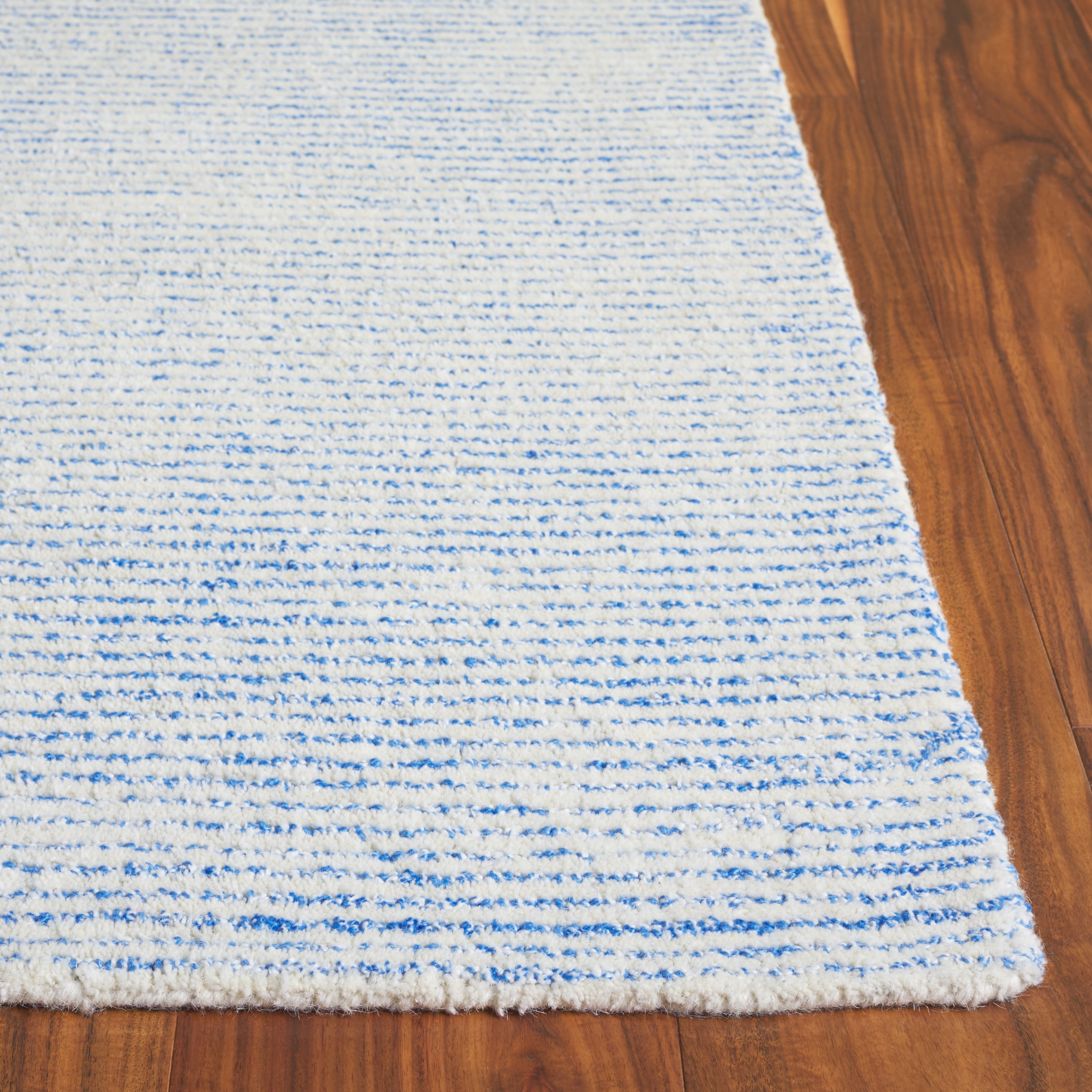 SAFAVIEH Abstract Rumen Solid Color Area Rug, Ivory/Blue, 3' x 5'