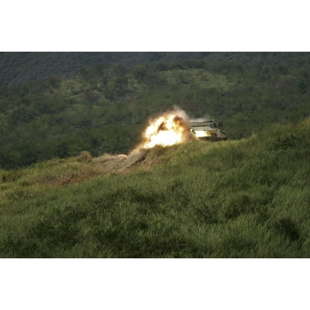 September 28 2006 - A Marine scores a direct hit while firing an AT-4 at an armored personnel carrier on Camp Hansens Rifle Range Poster