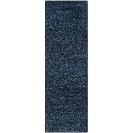 Safavieh SAFAVIEH California Shag Collection SG151-7070 Navy Rug SAFAVIEH California Shag Collection SG151-7070 Navy Rug SAFAVIEH s California Shag Collection imparts breezy coastal vibes throughout room decor. These plush pile shags are made using high-quality synthetic yarns  machine-woven into luxurious shag textures and colored in vivid hues with stylishly speckled tonal colors. These superior non-shedding shag rugs add flowing dimension to any decor  and are also well-suited for higher-traffic areas of the home with frequent kid or pet activity. Perfect for the living room  dining room  bedroom  study  home office  nursery  kid s room  or dorm room. Rug has an approximate thickness of 2 inches. For over 100 years  SAFAVIEH has set the standard for finely crafted rugs and home furnishings. From coveted fresh and trendy designs to timeless heirloom-quality pieces  expressing your unique personal style has never been easier. Begin your rug  furniture  lighting  outdoor  and home decor search and discover over 100 000 SAFAVIEH products today.