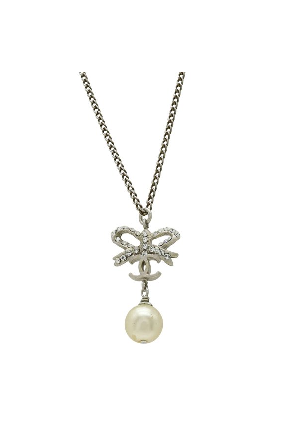 Pre-Owned CHANEL Coco Mark Ribbon Faux Pearl Necklace Pendant with Metal Rhinestones, Silver...