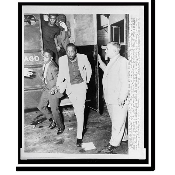 Historic Print, [Comedian Dick Gregory, James Sanders, and other African American men leaving police wagon for a court appearance in Chicago], 16" x 20"