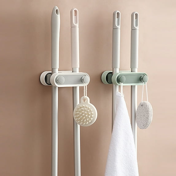 Dream Lifestyle Mop and Broom Holder , Wall Mount Creative Cleaning Tools , Self Adhesive Broom Gripper Holds with 2 Rack Slots and 2 Hooks for Kitchen Garage Garden and Office
