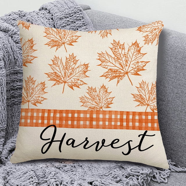 Thanksgiving Decorative Pillow Cover Set featuring one of four styles, made of durable linen material. The 18x18 inch cushion case displays an orange maple leaf pattern with a gingham stripe and the word 'Harvest' in elegant script. Designed with a hidden zipper closure, it is machine washable and ideal for fall home decor on sofas, couches, or beds.