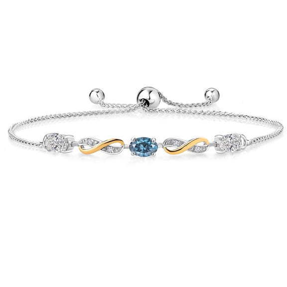 Gem Stone King 925 Silver and 10K Yellow Gold Lab Grown Diamond and Persian Blue Moissanite Bracelet for Women | 1.28 Cttw | Gemstone April Birthstone | Oval 6X4MM | Fully Adjustable 9"