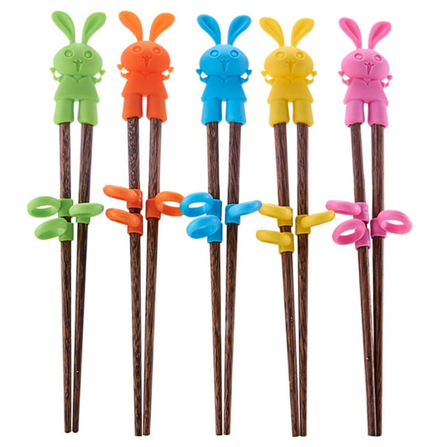 Kids Wood Learning Chopsticks featuring a set of wooden chopsticks with colourful silicone cartoon rabbit toppers and adjustable silicone ring buckles for easy training. Includes one pair of chopsticks, a random delivery box, and six silicone ring buckles. Designed for children to learn chopstick usage with ease.