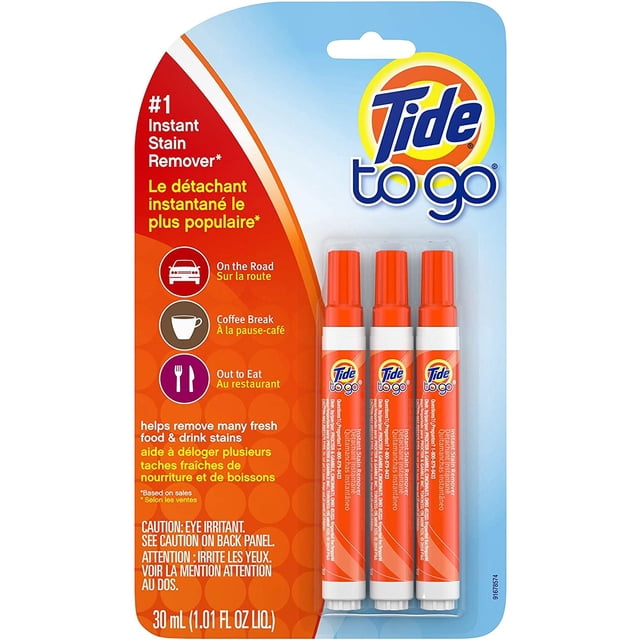 tide to go. quitamanchas (3 unidades) empaque frontal con tres bolígrafos quitamanchas instantáneo Tide to Go alineados verticalmente; bolígrafos tipo pluma color naranja con tapa naranja y etiqueta con logo Tide to Go, texto en el empaque sobre uso en carretera, pausa de café y comer fuera, 30 ml cada uno, portátil para llevar en maletines o bolsos.