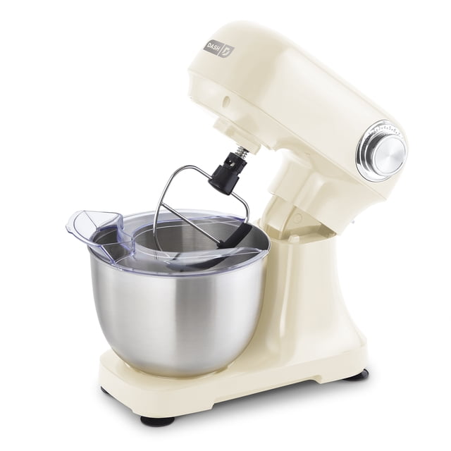 Cream Dash tilt-head 3.5qt stand mixer with stainless steel bowl, clear splash guard, and paddle attachment.