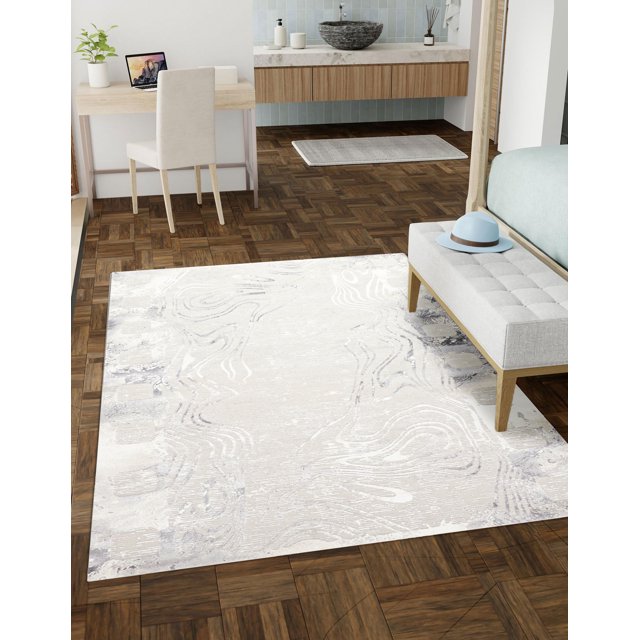 ECARPET Nova Contemporary/Modern Area Rug for Living Room, Bedroom, Dining Room, Entrance, Hallway and More shown in a bright room with parquet wood flooring, featuring a light grey marble-inspired abstract pattern rug under a tufted bench with a blue hat, near a wooden desk with a beige chair and a bathroom vanity with a stone vessel sink and blue tile backsplash, ideal for adding warmth and style to various home spaces.