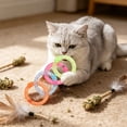 thumbnail image 5 of Soft Mesh Tube Donut Cat Toy with Bells, Interactive Teething Chew Ring for Indoor Cats, Crinkle Voice Kicking Toy for Tooth Th, Multicolor, by IHXORA, 5 of 6