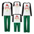 thumbnail image 1 of Una Familia De Tres Y Cuatro Personas Con Pijama Navideño., 1 of 2