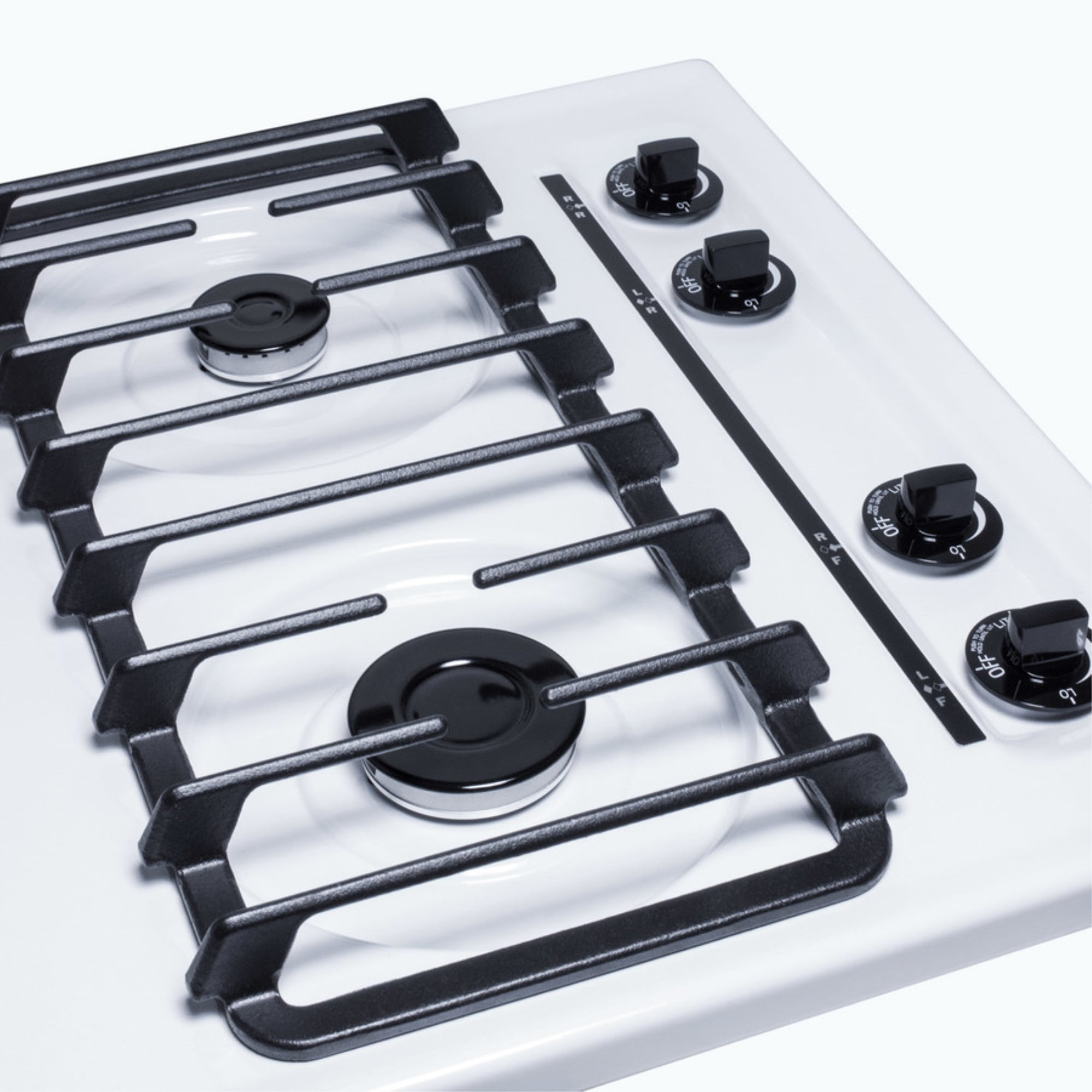 24" wide gas cooktop with four sealed burners, white porcelain surface, and cast iron grates; made in the USA
