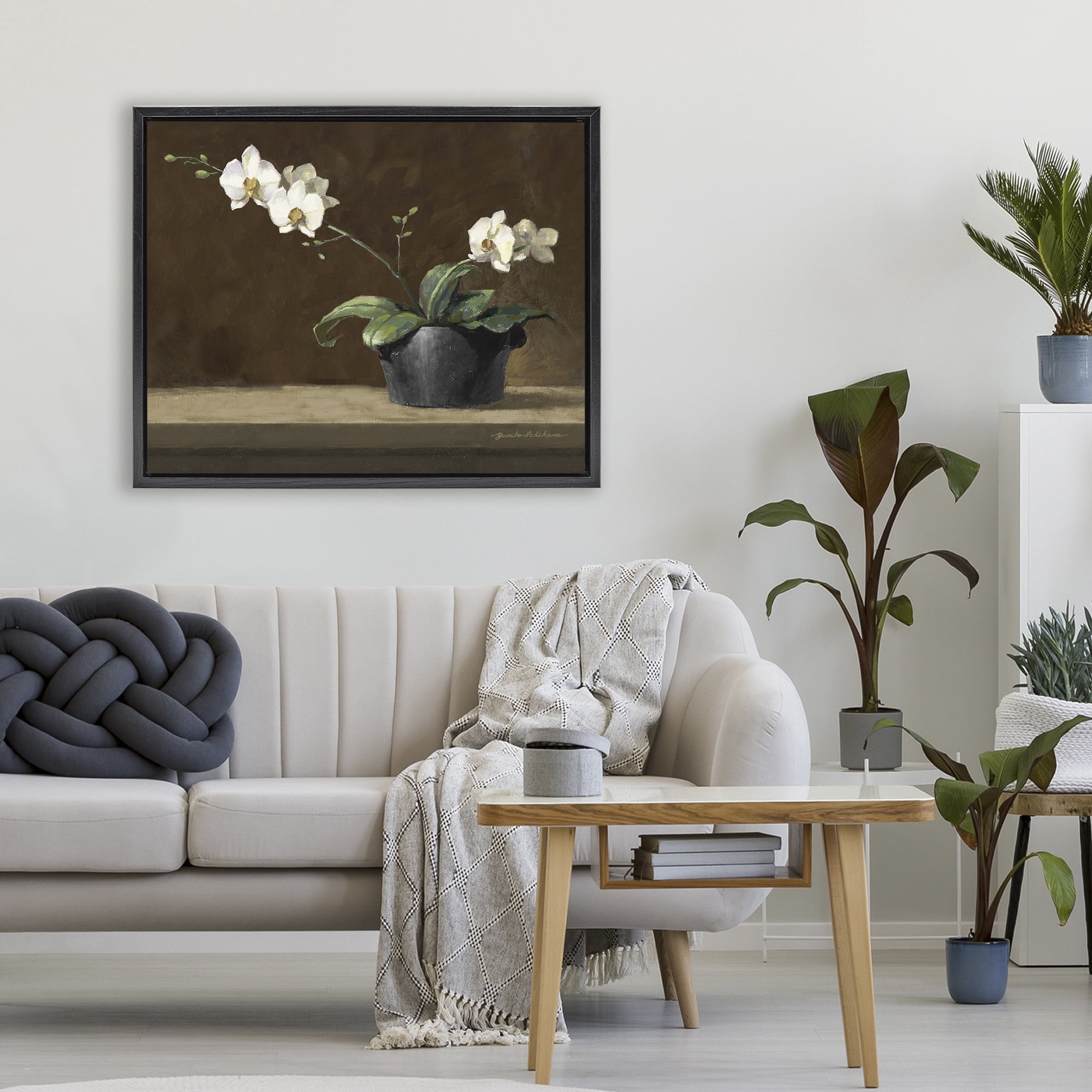 Stupell Industries Potted White Orchid on Ledge Black Framed Floater Canvas Wall Art, design by Yumiko Ichikawa