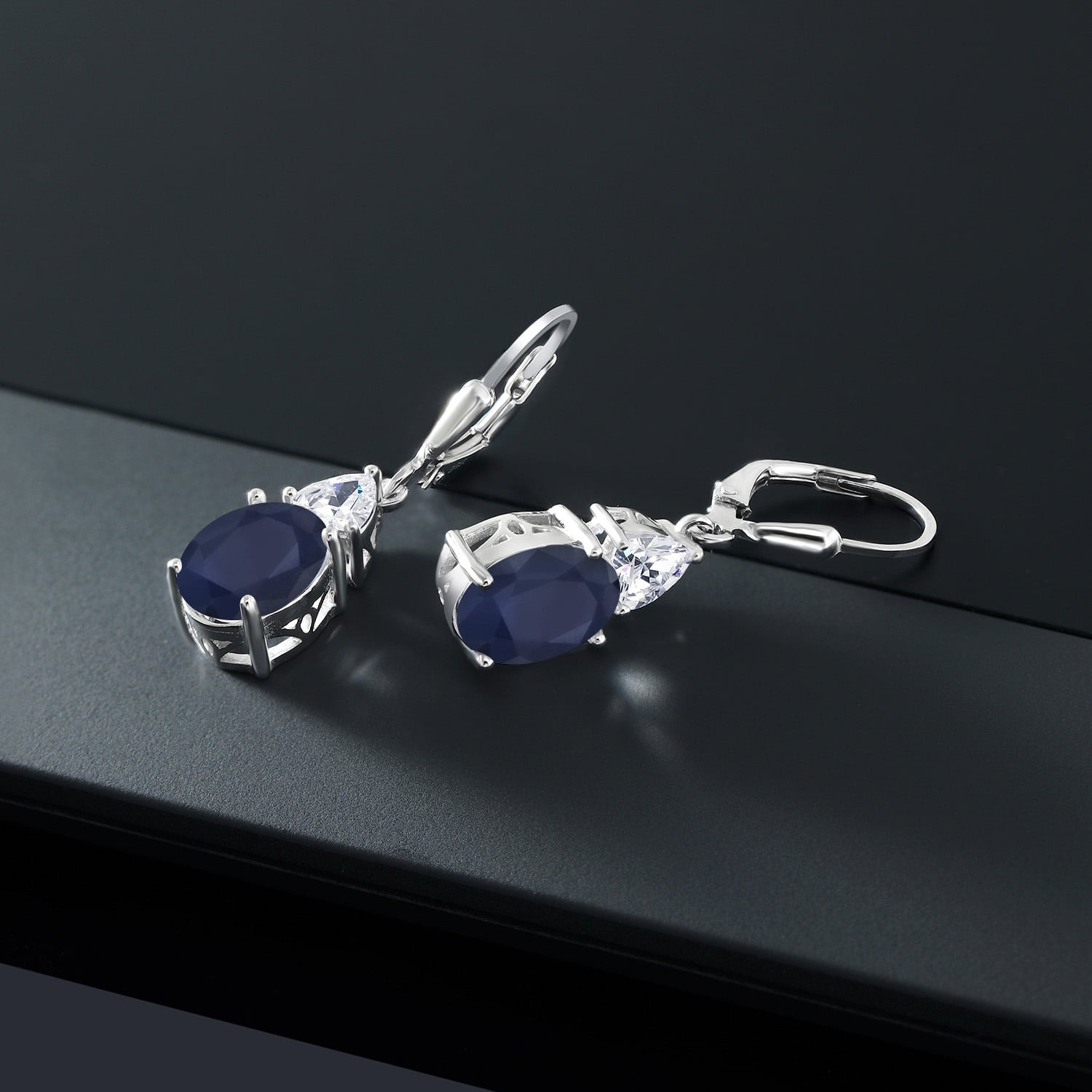 Gem Stone King 925 Sterling Silver Blue Sapphire and White Moissanite Dangle Earrings for Women (6.94 Cttw, Gemstone September Birthstone, Oval 10X8MM, Trillion 5MM)