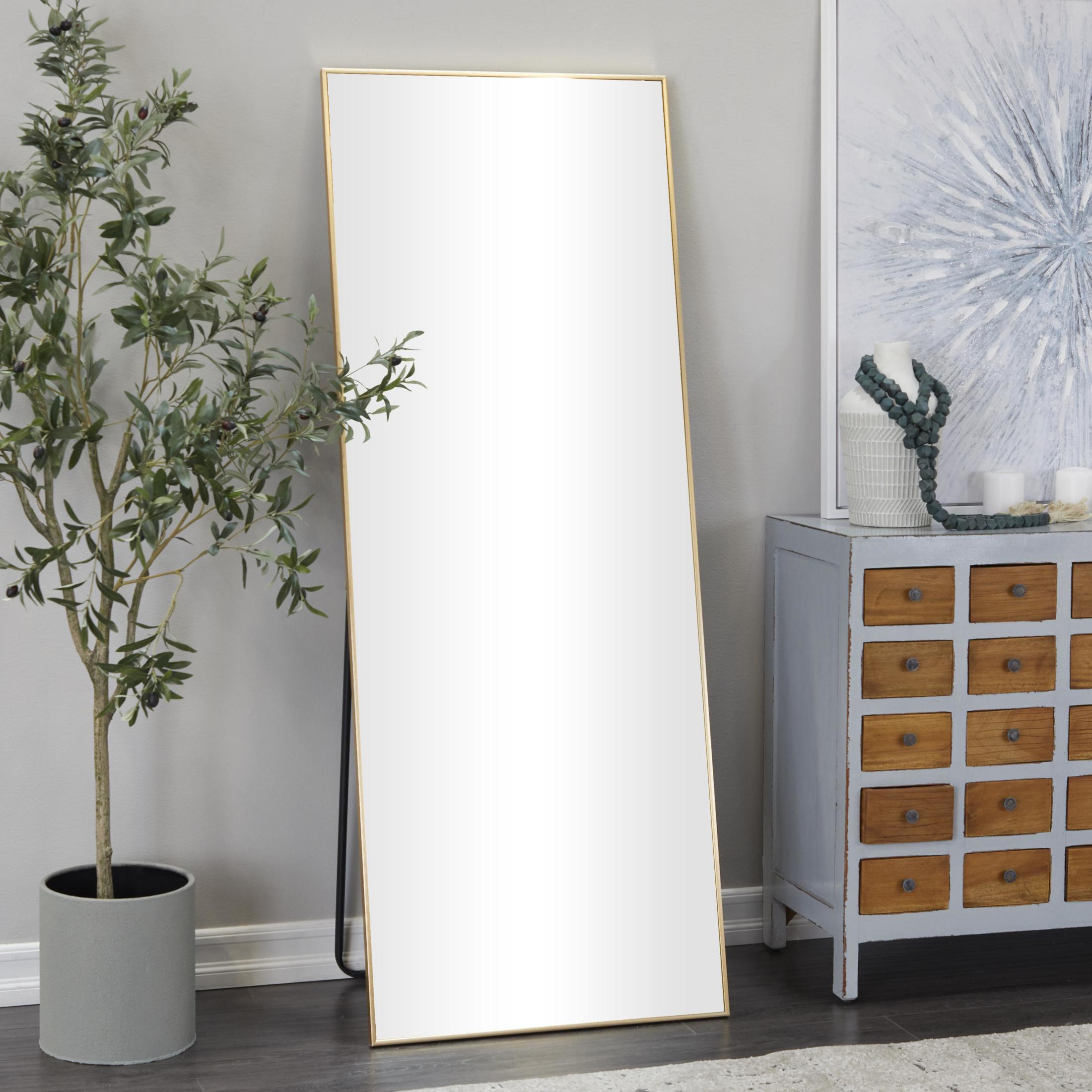 CosmoLiving by Cosmopolitan 26" x 65" Gold Metal Floor Mirror with Stand