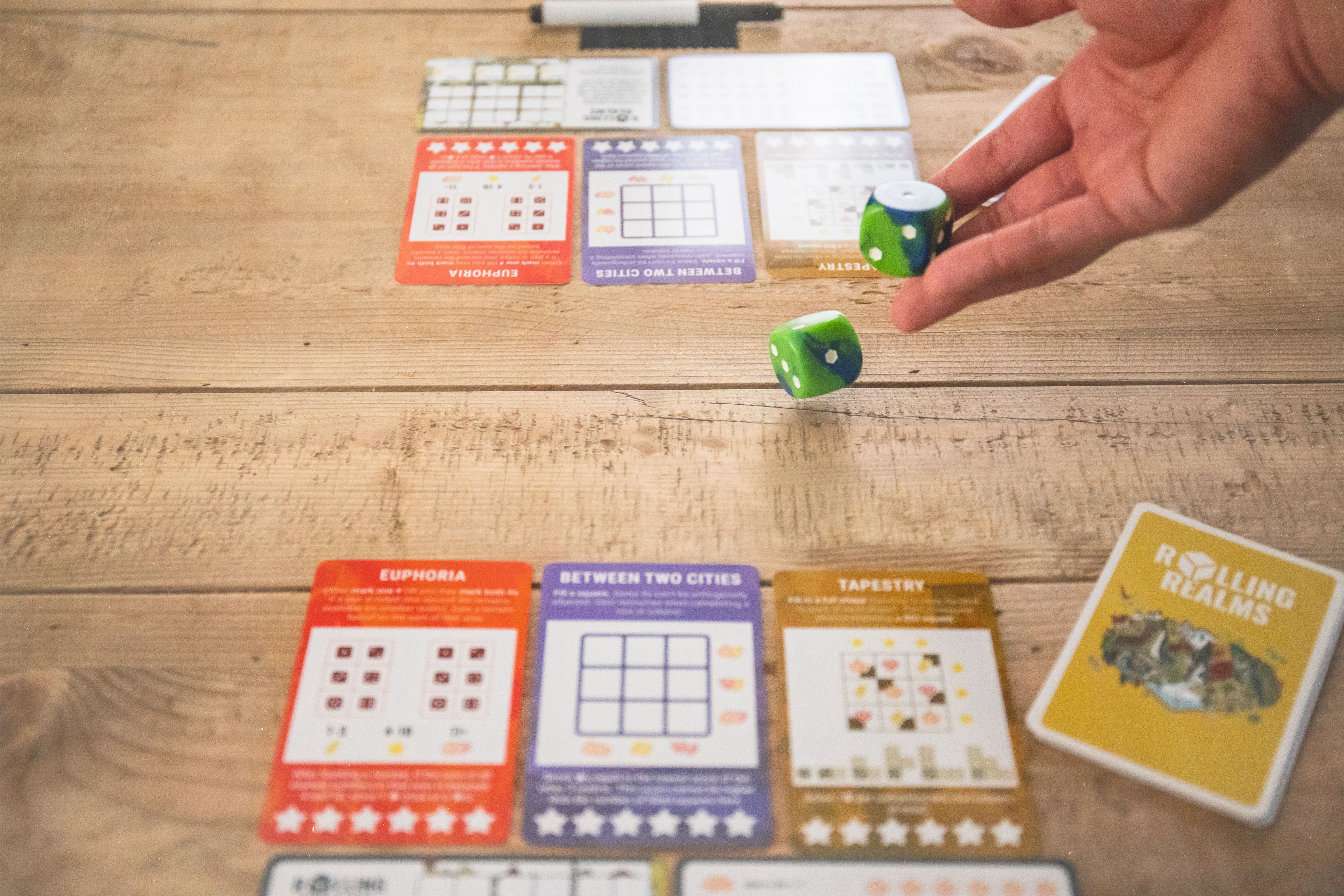 Rolling Realms by Jamey Stegmaier - A Roll-and-Write Strategy Board Game from Stonemaier Games