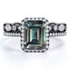 thumbnail image 1 of JeenMata Anillo de Bodas con Halo Enmarcado de 2 Quilates de Alejandrita Sintética de Corte Esmeralda y Moissanita Engastado con Banda de Bodas de Eternidad - Oro Negro de 18 K sobre Plata, 1 of 4