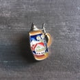 thumbnail image 2 of Oktoberfest Haus Metal Enamel Alpine Village Beer Stein Themed German Hat Pin with a Butterfly Clasp, 2 of 2