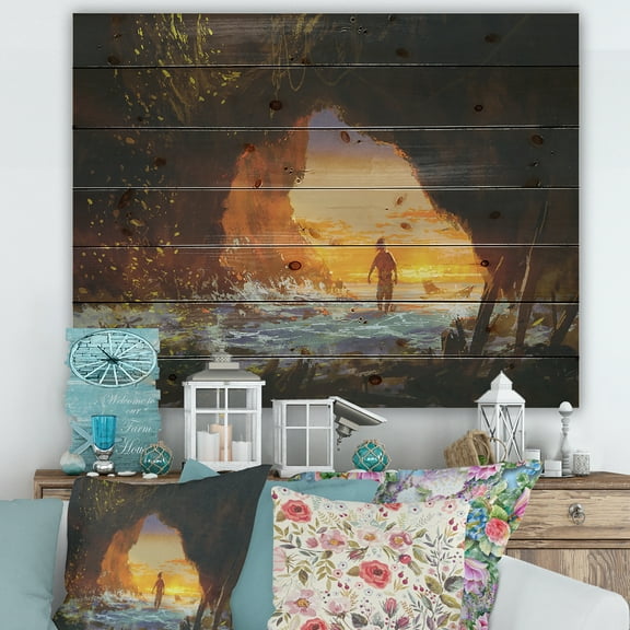 Designart 'The Sea Cave At Sunset With The Man Walking In' Nautical & Coastal Print on Natural Pine Wood
