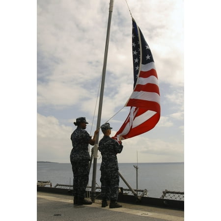 80 Tortuga Art - October 30 2011 - Sailors aboard the amphibious dock landing ship USS Tortuga shift colors while getting underway from White Beach Naval Installation in Okinawa Japan Poster Print