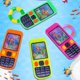 thumbnail image 5 of Set de juguetes retro: diseño de teléfono móvil, juego de agua y anillo submarino, 5 of 8
