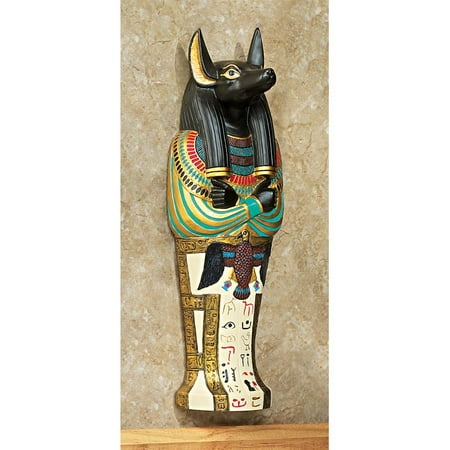 Design Toscano Icons of Ancient Egypt Wall Sculpture: Anubis • Hand-cast using real crushed stone bonded with high quality designer resin• Each piece is individually hand-painted by our artisans• Exclusive to the Design Toscano brand and perfect for your home or garden• Accented with bright tones and faux gold