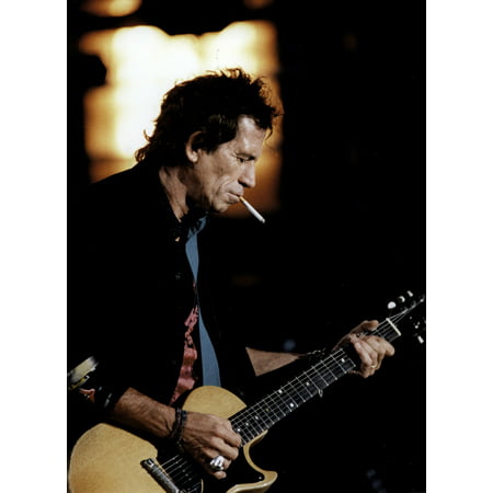 Keith Richards Playing Guitar while Smoking Photo