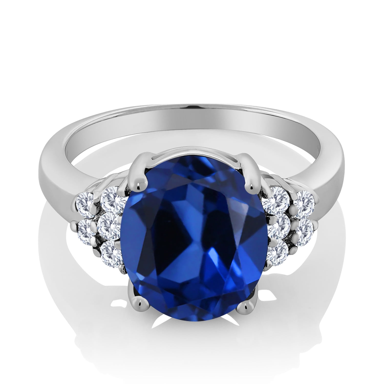 Gem Stone King 925 Sterling Silver Oval Blue Created Sapphire and White Moissanite Ring for Women (6.38 Cttw, Oval 12X10MM, Size 9)
