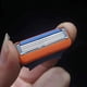 thumbnail image 3 of Cabezal de afeitado manual con cuchilla de afeitar de 5 capas de color naranja, 4 cuchillas por tarjeta, 3 of 5