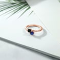 thumbnail image 3 of Gem Stone King 18K Rose Gold Plated Silver Black Onyx and Blue Created Sapphire Bypass Ring for Women (0.71 Cttw, Gemstone December Birthstone, Round 4MM, Size 8), 3 of 4