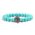 thumbnail image 1 of Pulsera con dije de huella de pata de piedra volcánica de lava negra mate natural, ideal como recuerdo para mascotas, amantes de los gatos y los perros., 1 of 2