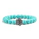 thumbnail image 1 of Pulsera con dije de huella de pata de piedra volcánica de lava negra mate natural, ideal como recuerdo para mascotas, amantes de los gatos y los perros., 1 of 2