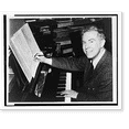 thumbnail image 2 of Historic Framed Print, [Elliott Carter, head-and-shoulders portrait, facing front, seated at piano, editing sheet of music], 17-7/8" x 21-7/8", 2 of 9