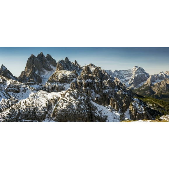 Rugged snow-covered mountain range with blue sky; San Candido, Bolzano, Italy by Michael Interisano / Design Pics (23 x 10)