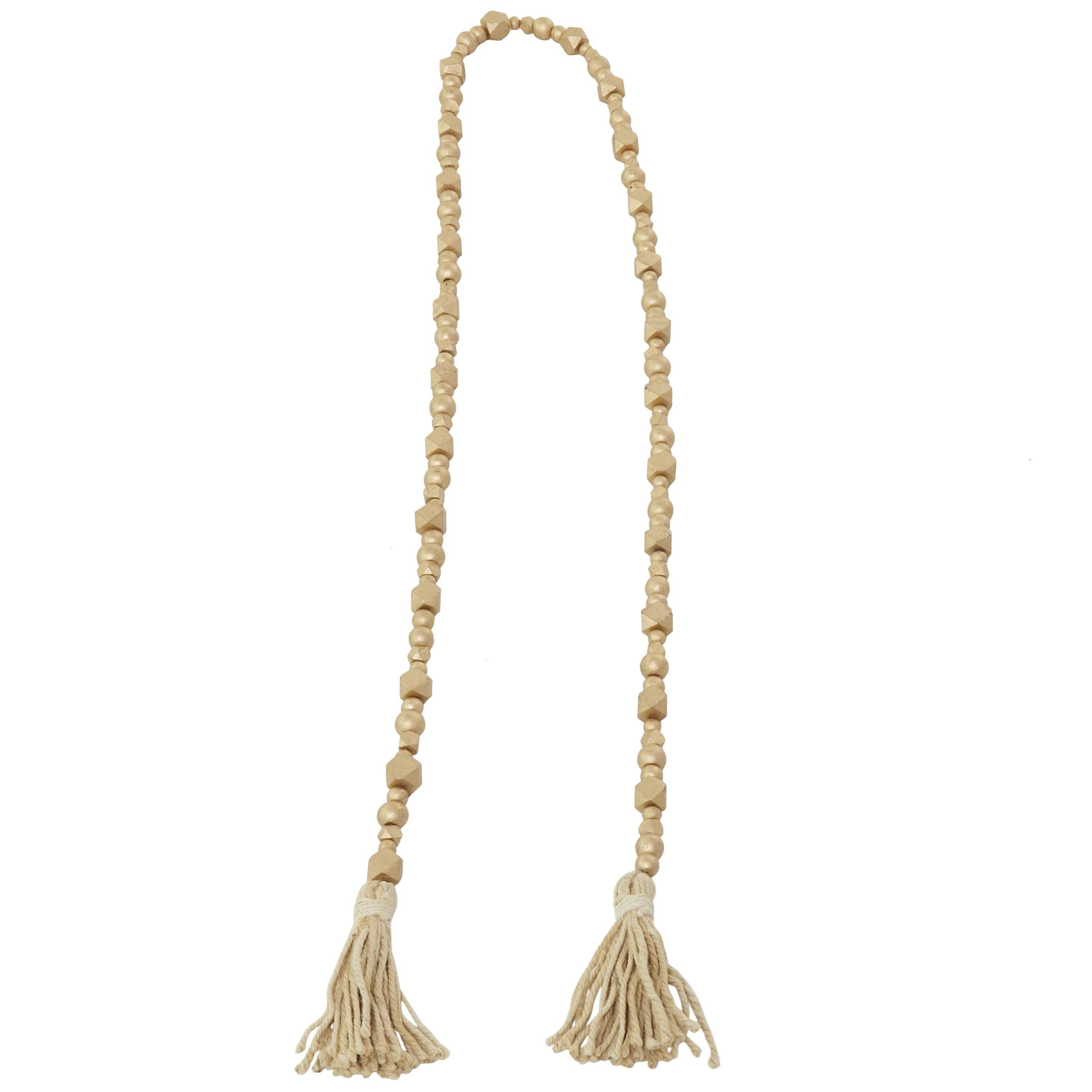 DecMode Handmade Hexagon Metallic Carved Geometric Long Gold Mango Wood Garland with Tassel