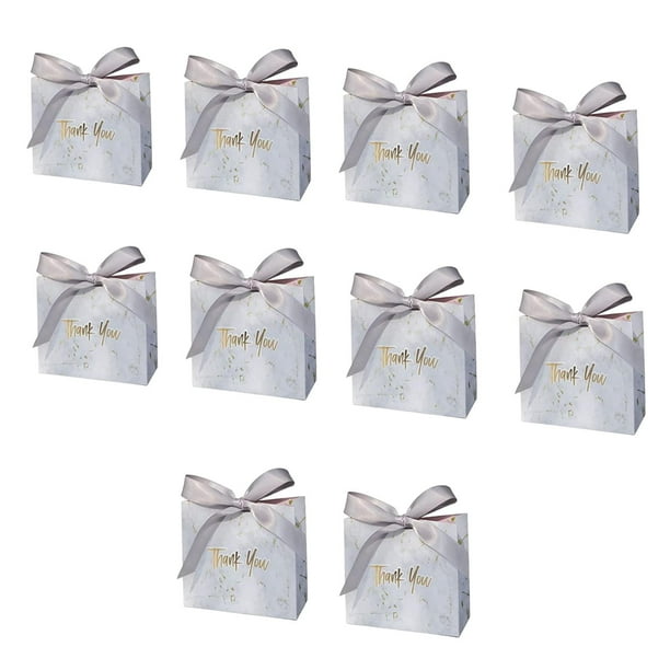 , cajas con cintas, cajas pequeñas para regalos, manualidades, magdalenas, dulces, suministros para