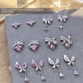 thumbnail image 1 of Colgante de lazo de circonita rosa con diamantes para uñas, joyería ligera de lujo, mariposa plateada, amor, diamantes en línea, 1 of 5
