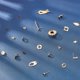 thumbnail image 4 of 1 caja de 46 pendientes de acero inoxidable de 16 estilos, que incluye 32 pendientes hipoalergénicos y 14 tuercas., 4 of 9