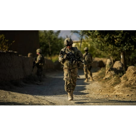 Air Force Staff Sergeant Stripes US Air Force Staff Sergeant makes his way to a local village in Afghanistan Poster Print by Stocktrek Images ()