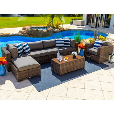 Tuscany 7-Piece Outdoor Patio Furniture Sectional Sofa Set with Four Modular Sectional Pieces, Armchair, Ottoman, and Coffee Table (Half-Round Brown Wicker, Sunbrella Canvas Charcoal)