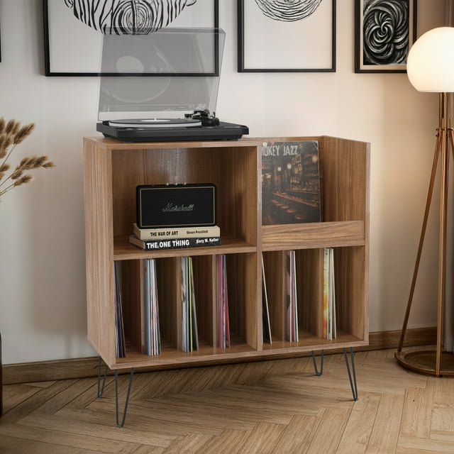 CorLiving Vintora large engineered wood media stand with open shelves displaying a turntable on top, a Marshall speaker and books in one compartment, and organized vinyl records in multiple slots.