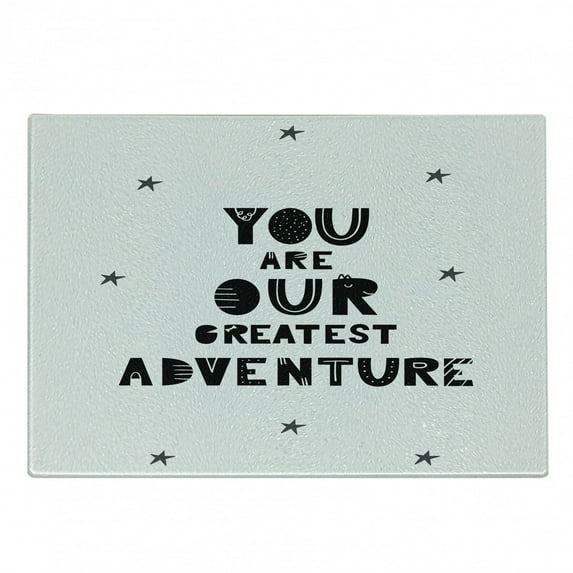 Adventure Cartoon Cutting Board, Calligraphic You are Our Greatest Adventure Texts with Crooked Stars, Decorative Tempered Glass Cutting and Serving Board, Small Size, Black and White, by Ambesonne