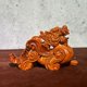 thumbnail image 1 of Ebony wood carved Pixiu figurine, solid wood carving, office desktop/living room decoration, for attracting wealth, protecting the home, housewarming, or business opening gifts., 1 of 4