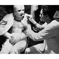 thumbnail image 2 of U.S. Sailor Dressed In Pressure Bandages After Suffering Burns During A Kamikaze Attack. He Is Being Fed Aboard The, 2 of 2
