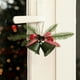 thumbnail image 4 of Adornos navideños con campanas de terciopelo rojo y lazos de hierro forjado para crear un ambiente festivo., 4 of 6