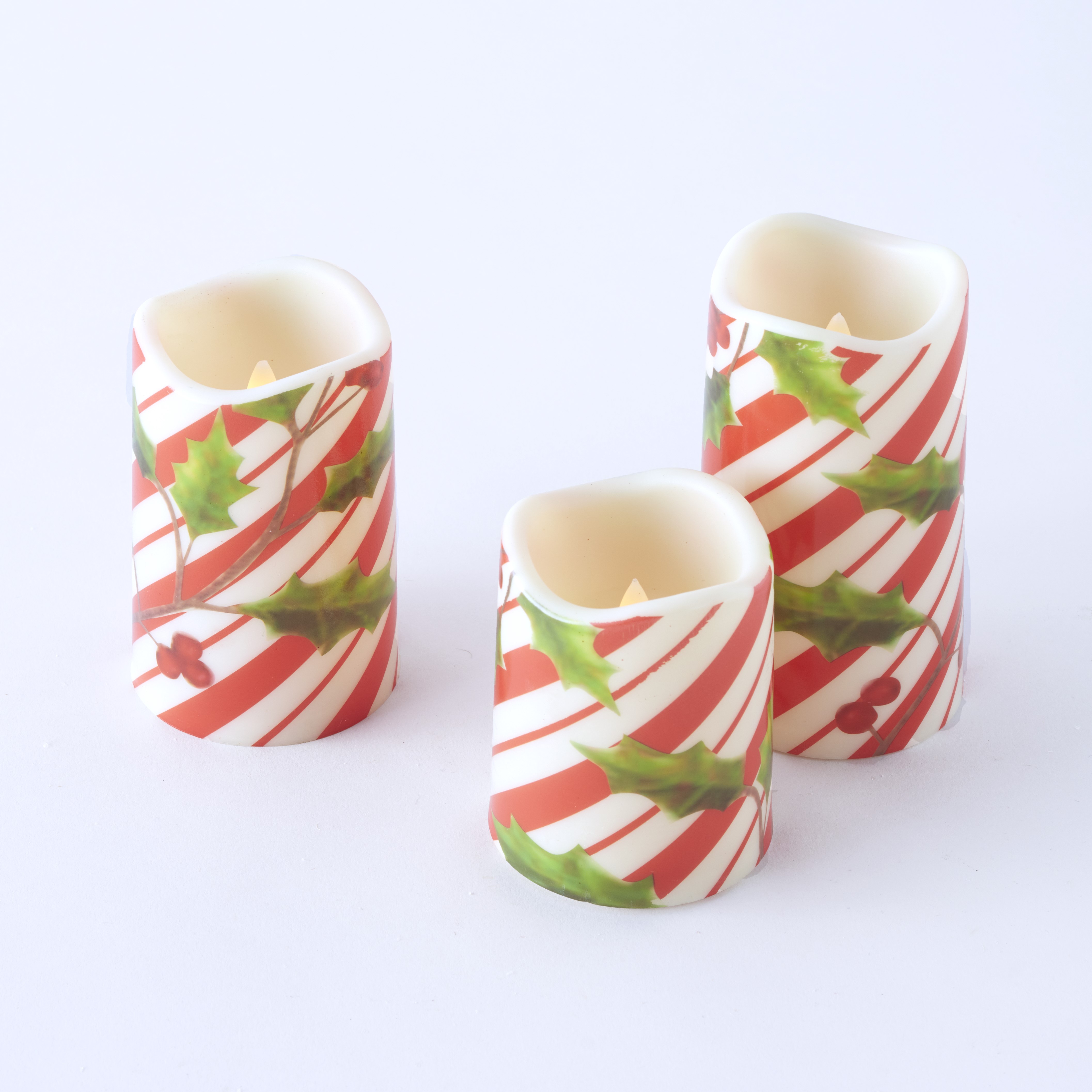 LED Candy Cane Motif Christmas Candles with Faux Floral Holly Leaves ...