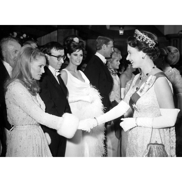 Queen Elizabeth Ii Shakes Hands Wursula Andress After Woody Allen