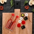 thumbnail image 4 of Mini botellas de salsa picante Cornucopia de 3 onzas (paquete de 24); Pequeñas botellas de salsa con tapas rojas, inserciones de gotero y bandas retráctiles negras, 4 of 5